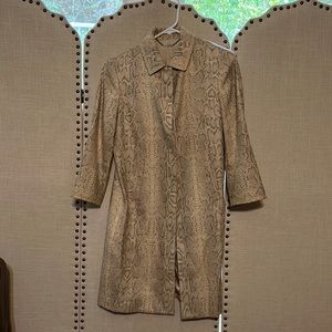 Trench style coat.. beautiful lines with a silk like material